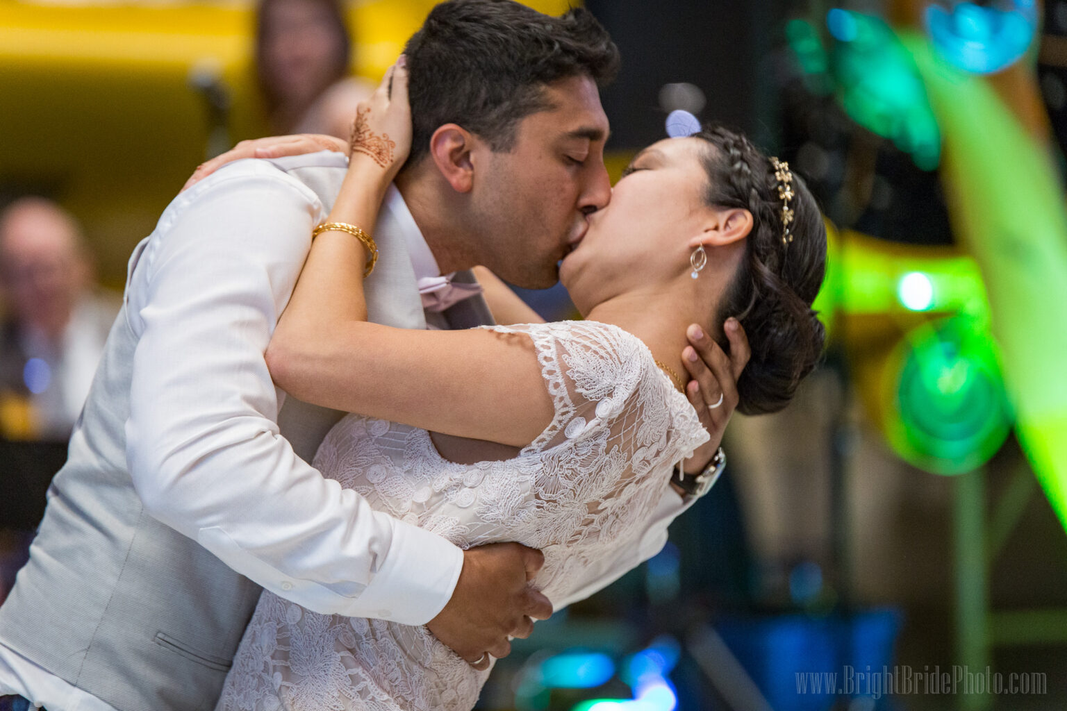 Isabel and Jack sharing a kiss during their wedding celebration